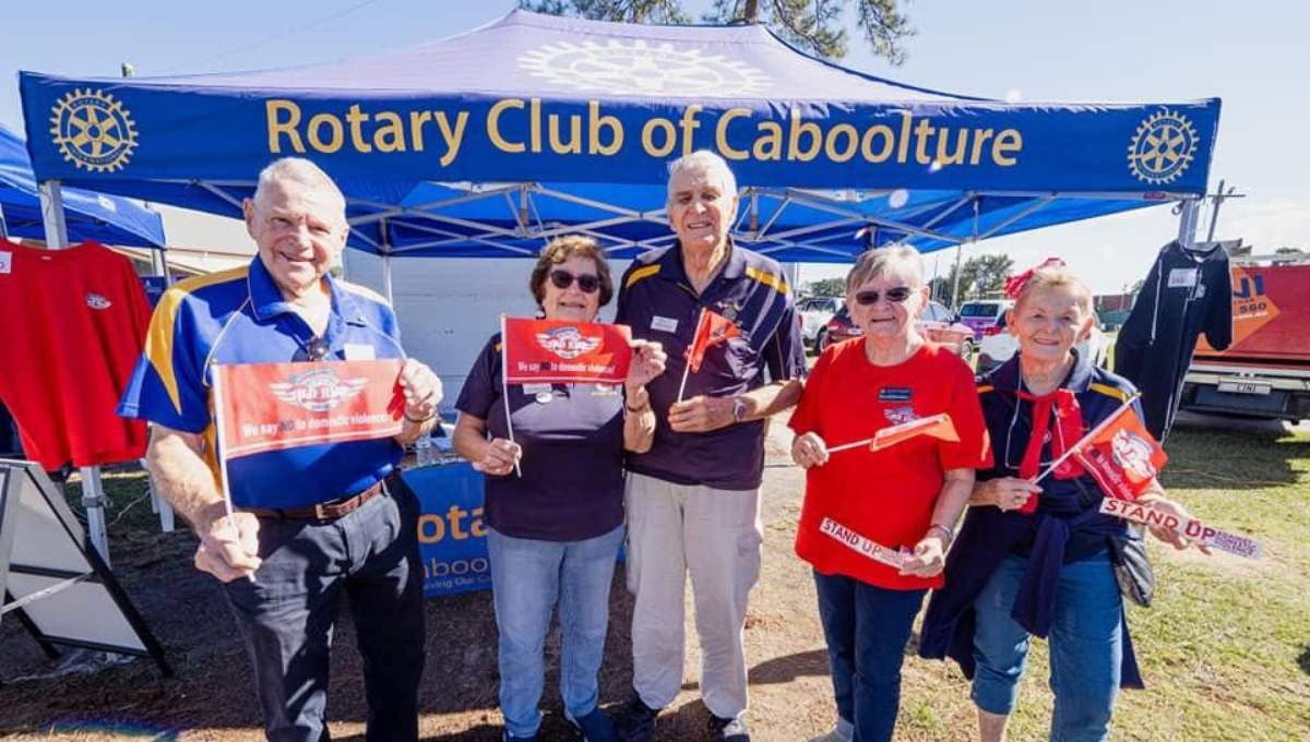 Group photo of smiling Rotary Club of Caboolture volunteers