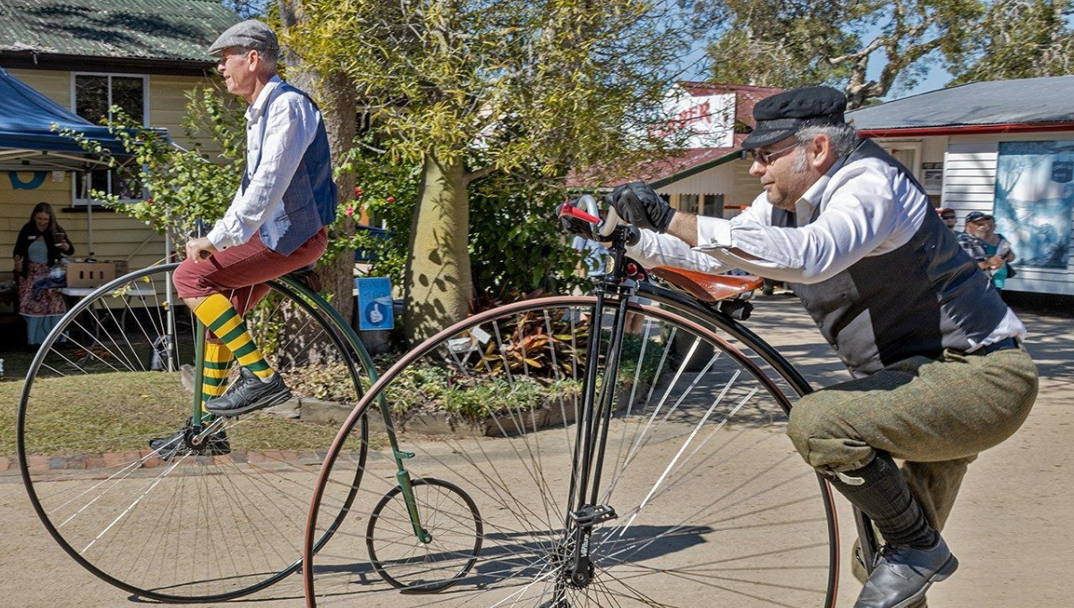 Two local men riding old-fashioned bikes for Heritage Day