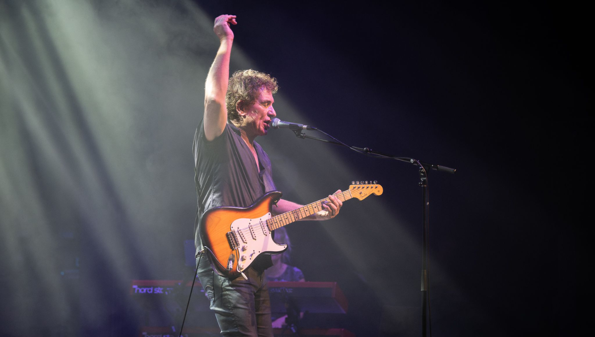 Photo of musician Ian Moss performing on stage