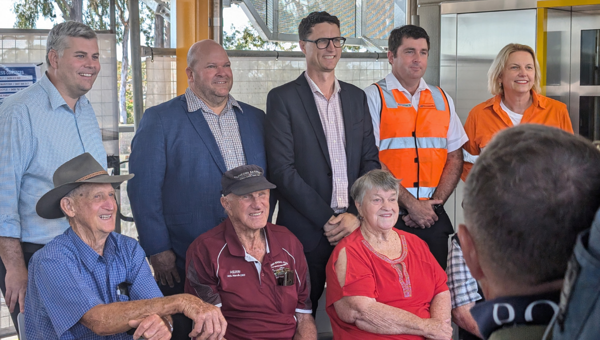 Shirley (bottom, third from left) with dignitaries including Mark Ryan (top left) and other attendees at Opening Day